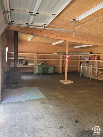 97 East Main Street Stockton, UT 84071 - Photo 29 of 58 View of garage/workshop with wood burning stove