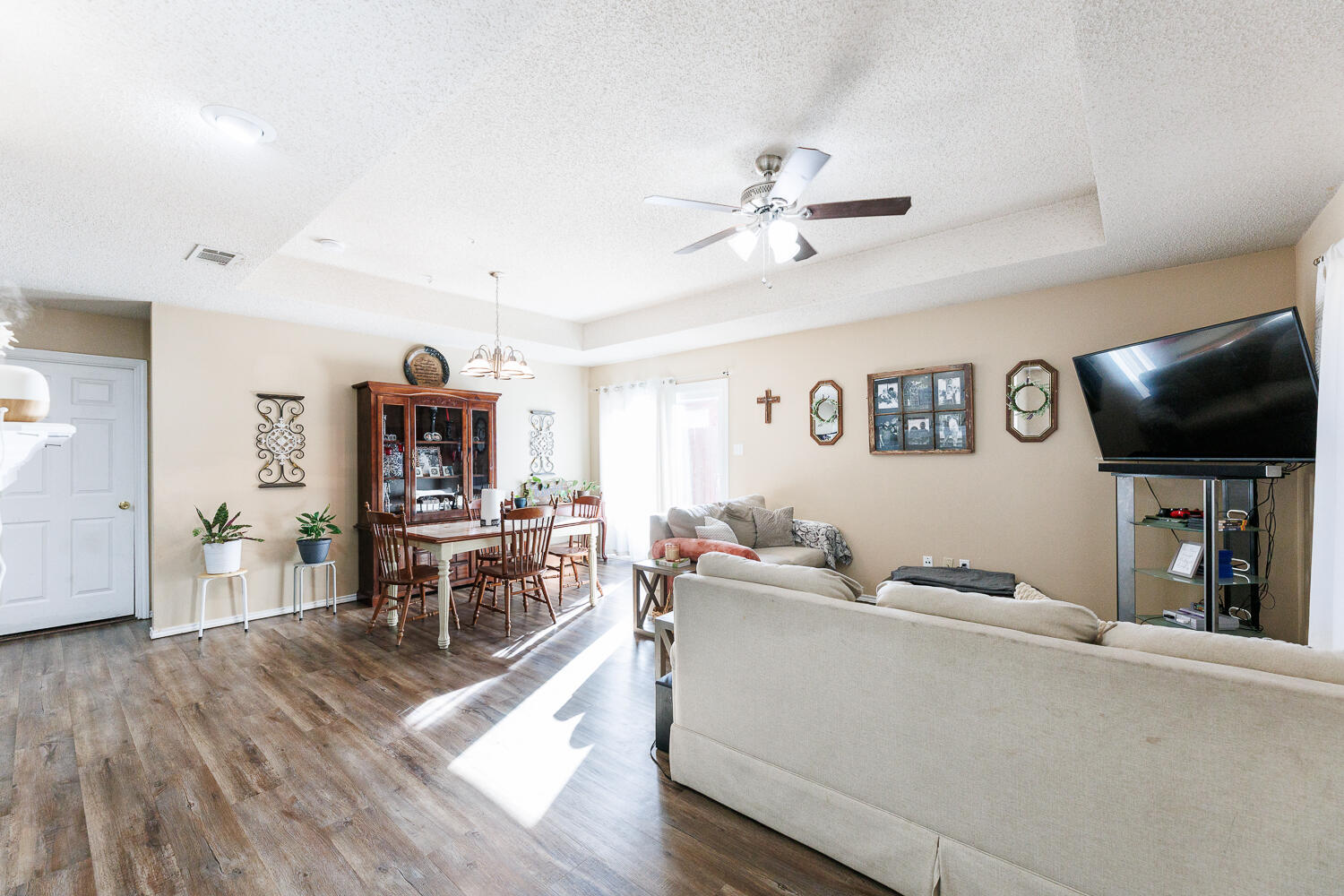 3423 97th Street Lubbock, TX 79423 - Photo 11 of 26 a living room with furniture and a flat screen tv