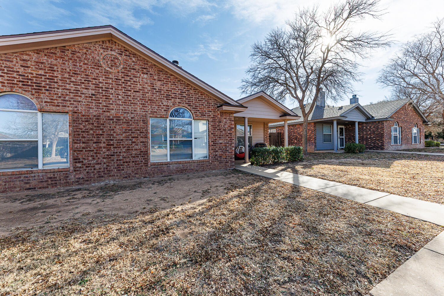 3423 97th Street Lubbock, TX 79423 - Photo 2 of 26 front view of a house with a yard