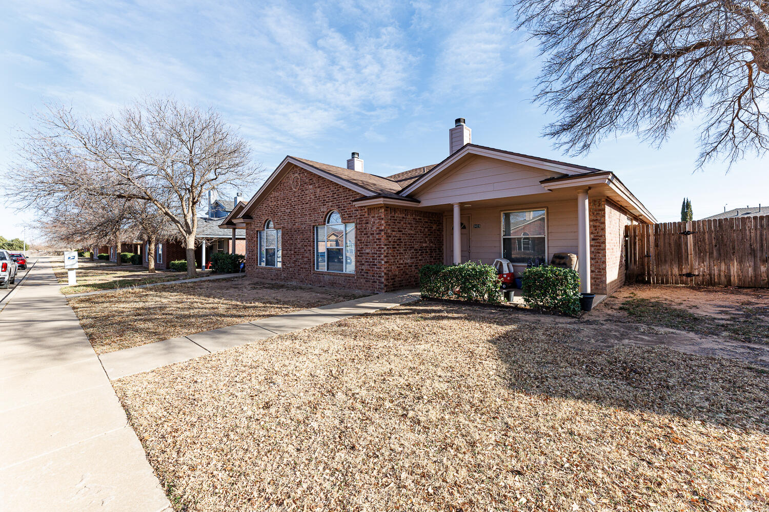 3423 97th Street Lubbock, TX 79423 - Photo 3 of 26 a front view of a house with a yard