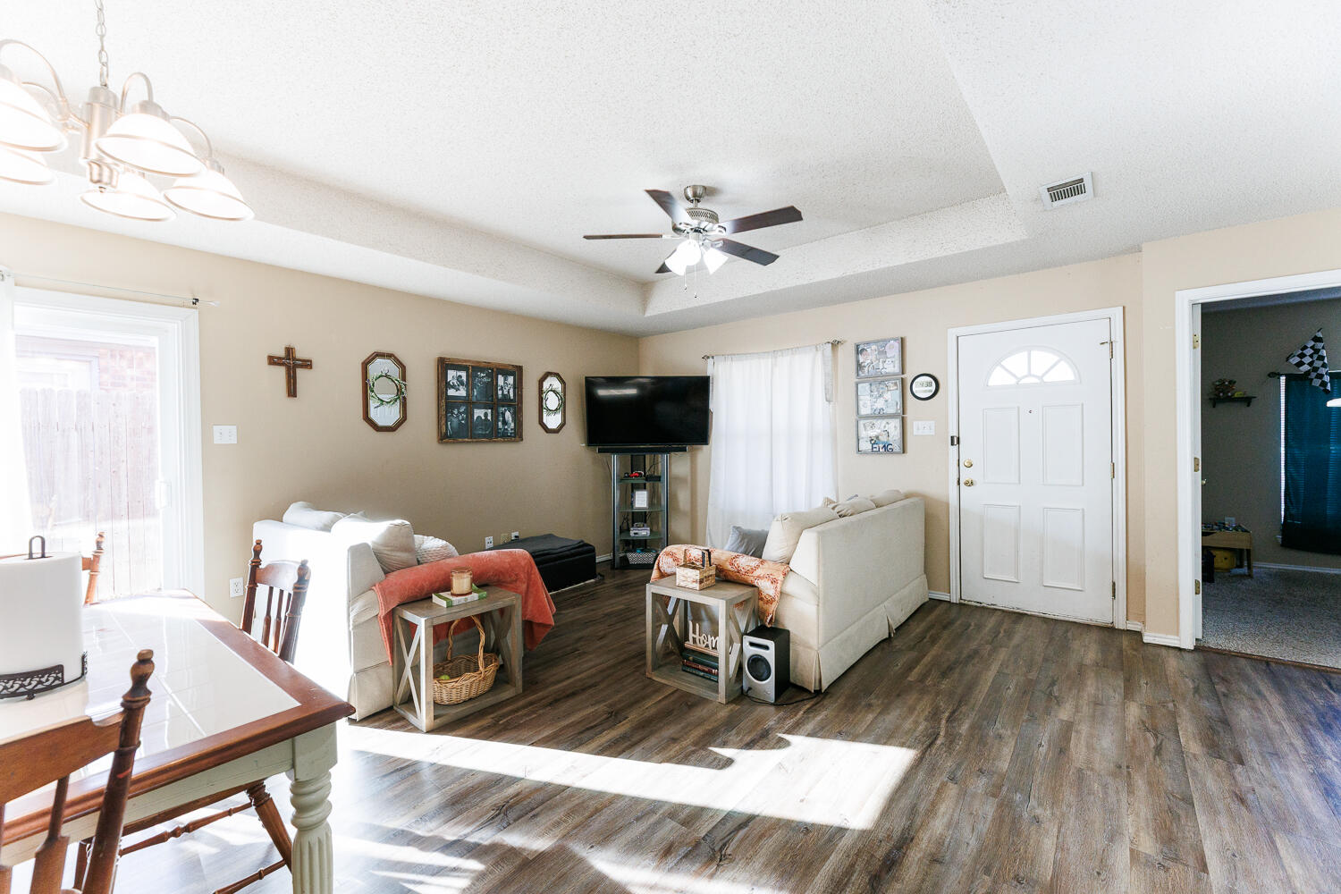 3423 97th Street Lubbock, TX 79423 - Photo 9 of 26 a living room with furniture and a wooden floor