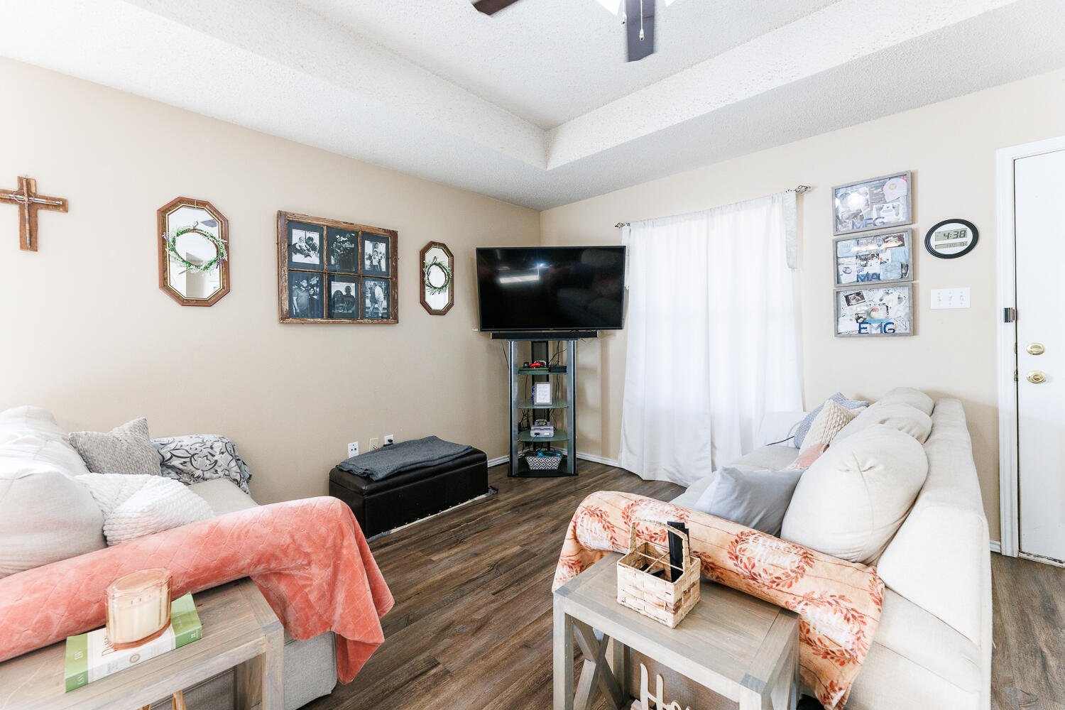 3423 97th Street Lubbock, TX 79423 - Photo 10 of 26 a living room with furniture and a flat screen tv