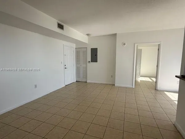 a view of a livingroom with an empty space and a sink