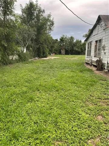 a view of outdoor space with deck and yard