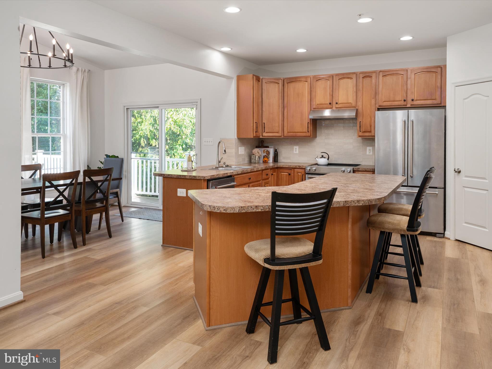 1704 Canal Clipper Court Point of Rocks, MD 21777 - Photo 13 of 75 a kitchen with stainless steel appliances granite countertop refrigerator dining table and chairs