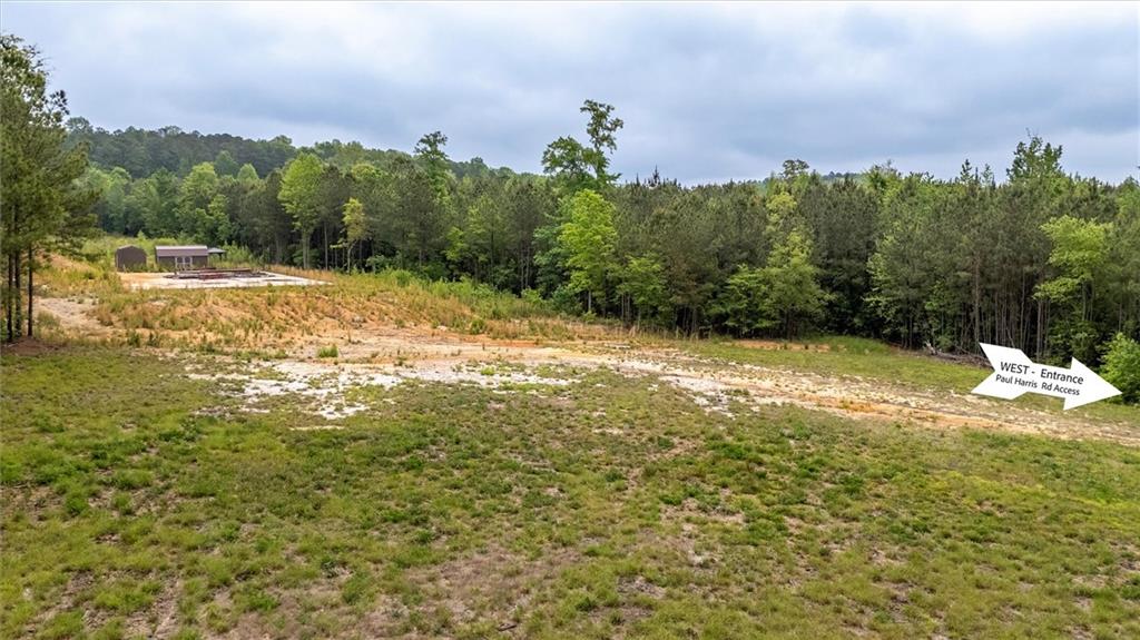 51 Paul Harris Road Dallas, GA 30157 - Photo 2 of 13 a view of a yard with a house in the background