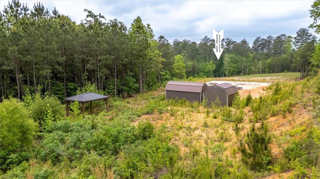 51 Paul Harris Road Dallas, GA 30157 - Photo 10 of 13 a backyard of a house with table and chairs