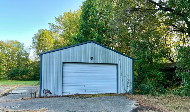 a house with trees in the background