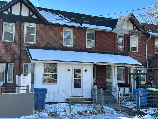 a front view of a house with table