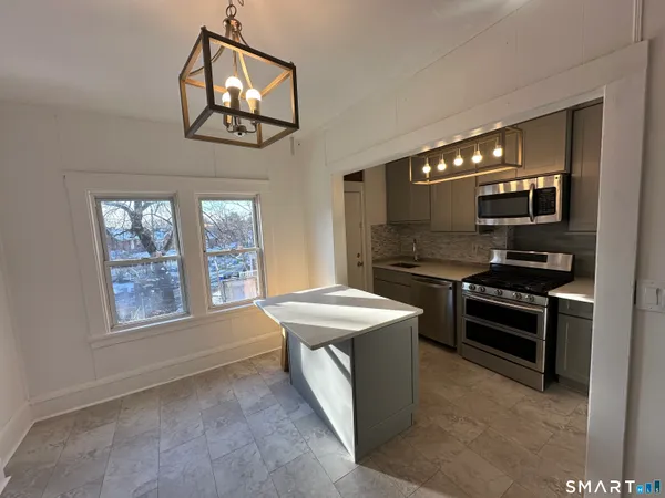 a kitchen with a stove and a microwave