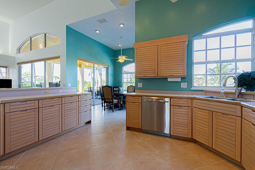 4401 Pond Apple Drive South Naples, FL 34119 - Photo 15 of 35 a kitchen with sink and window