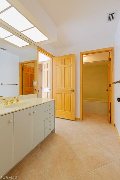 4401 Pond Apple Drive South Naples, FL 34119 - Photo 22 of 35 a spacious bathroom with 2 sink tub and a shower