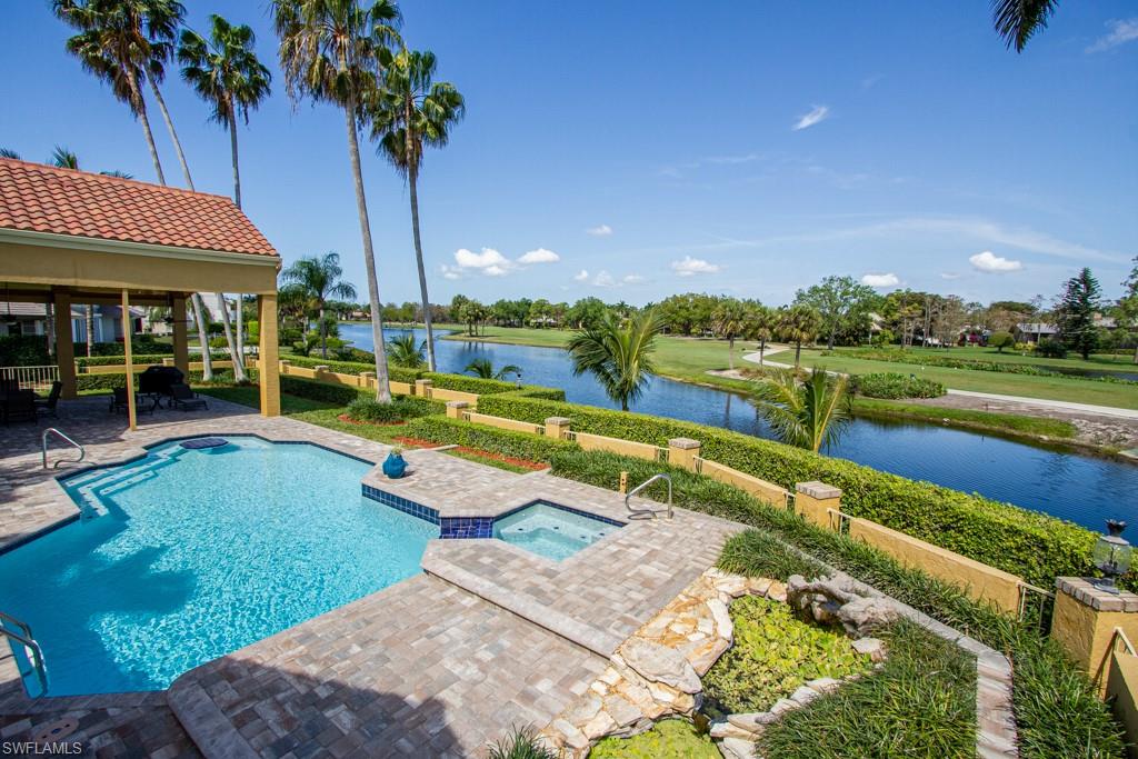4401 Pond Apple Drive South Naples, FL 34119 - Photo 32 of 35 a view of a swimming pool with a patio