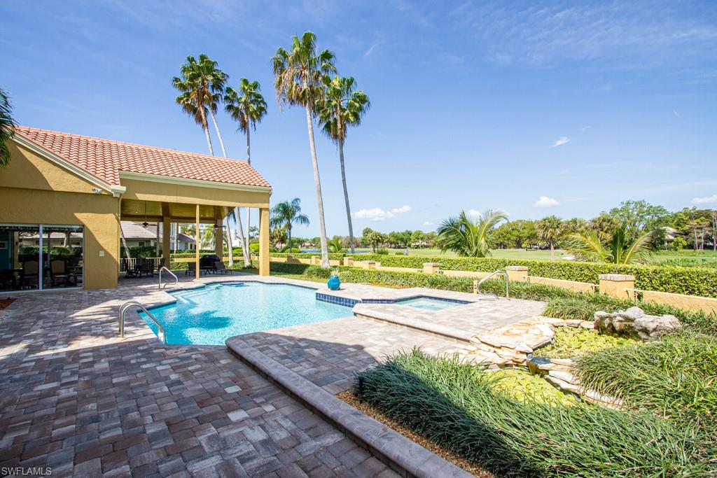 4401 Pond Apple Drive South Naples, FL 34119 - Photo 35 of 35 a view of a swimming pool with a patio