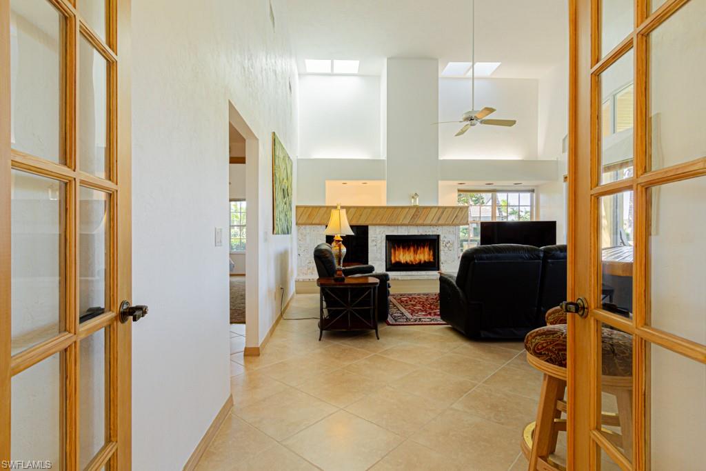 4401 Pond Apple Drive South Naples, FL 34119 - Photo 9 of 35 a view of kitchen with furniture and a refrigerator