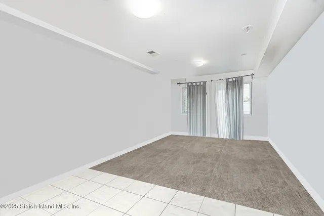 a view of a room with an empty space