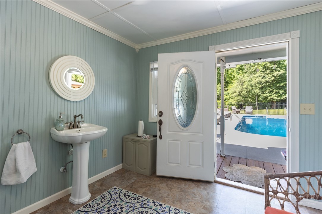 1335 Shingle Gap Road Purlear, NC 28665 - Photo 34 of 49 a bathroom with a sink a mirror and a window