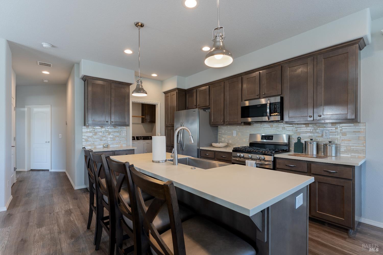 36 Blanco Place Ukiah, CA 95482 - Photo 6 of 20 a kitchen that has a table chairs stainless steel appliances and cabinets