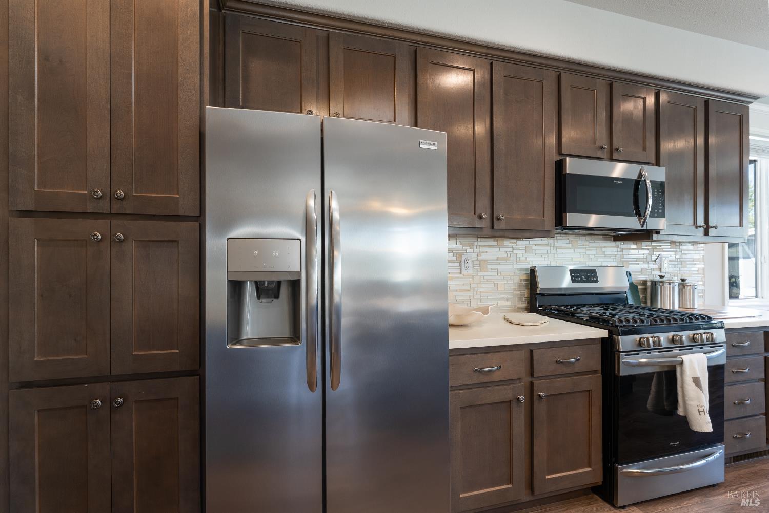 36 Blanco Place Ukiah, CA 95482 - Photo 8 of 20 a kitchen with a refrigerator stove and microwave