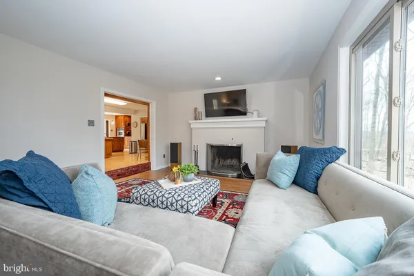 a living room with furniture fireplace and flat screen tv
