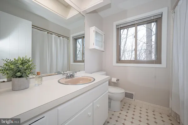 a view of a room with toys and wooden floor