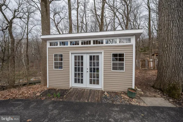a aerial view of a house with swimming pool and sitting area