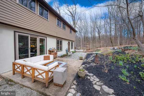 a view of a patio with table and chairs and potted plants