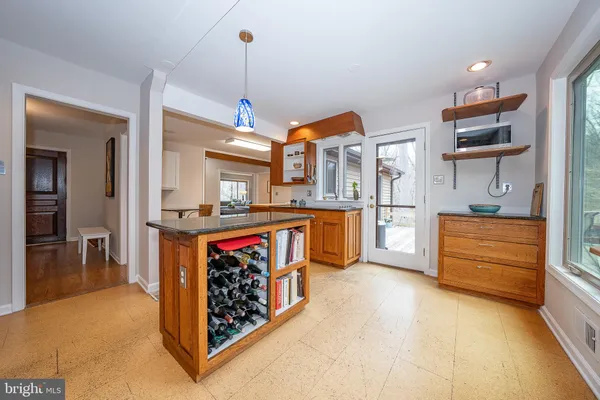 a kitchen with stainless steel appliances granite countertop a sink and cabinets