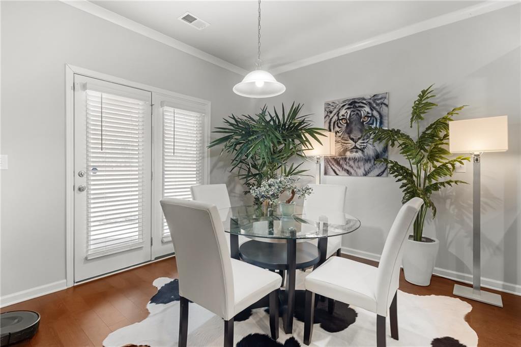 1476 Harlequin Way Stockbridge, GA 30281 - Photo 11 of 57 a view of a dining room with furniture and wooden floor