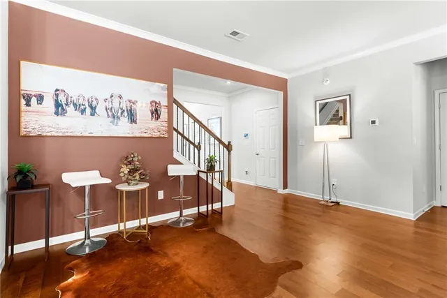 a bathroom with a double vanity sink a mirror and bathtub