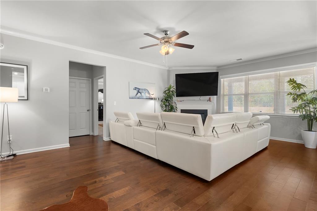 1476 Harlequin Way Stockbridge, GA 30281 - Photo 18 of 57 a living room with furniture and a flat screen tv