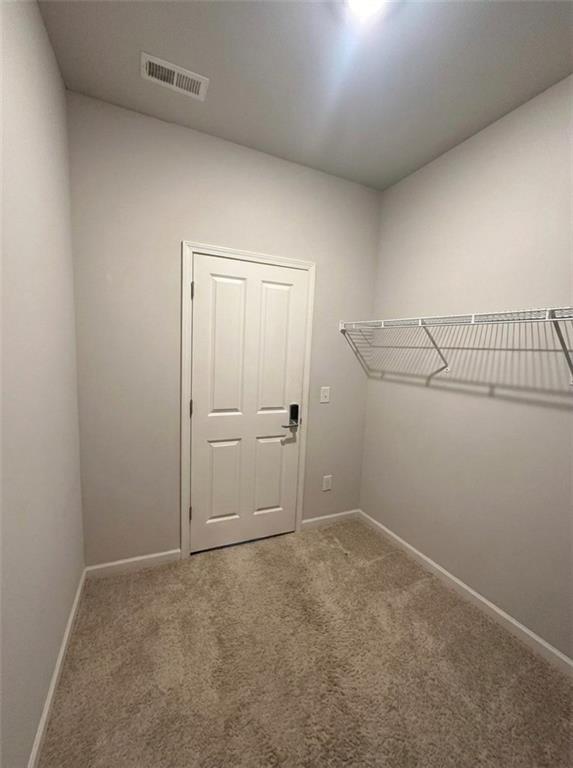 1476 Harlequin Way Stockbridge, GA 30281 - Photo 27 of 62 an empty room with shelves