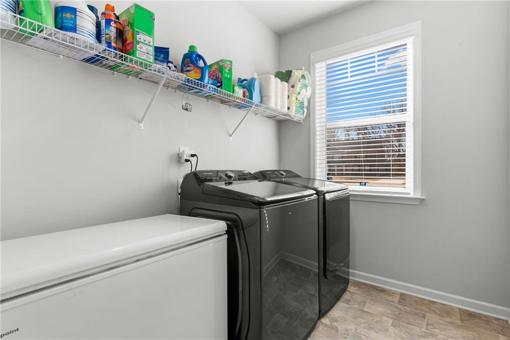1476 Harlequin Way Stockbridge, GA 30281 - Photo 28 of 57 a utility room with dryer and washer