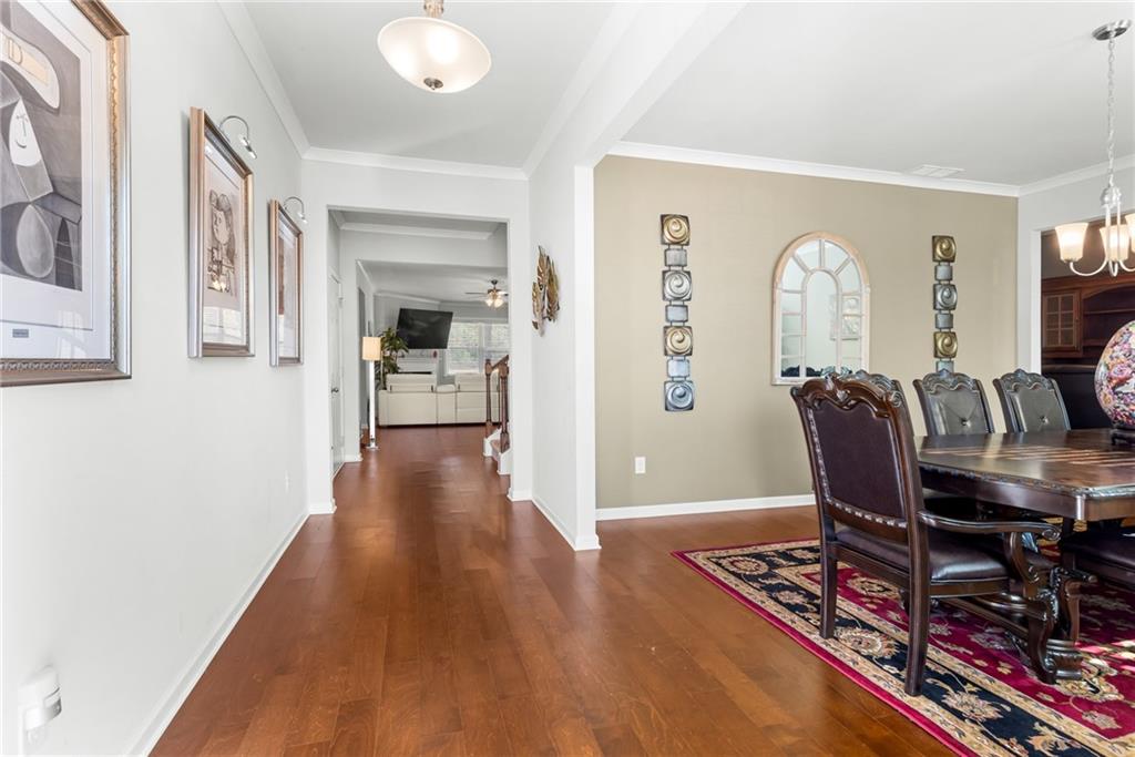 1476 Harlequin Way Stockbridge, GA 30281 - Photo 4 of 57 a view of a hallway with wooden floor and furniture