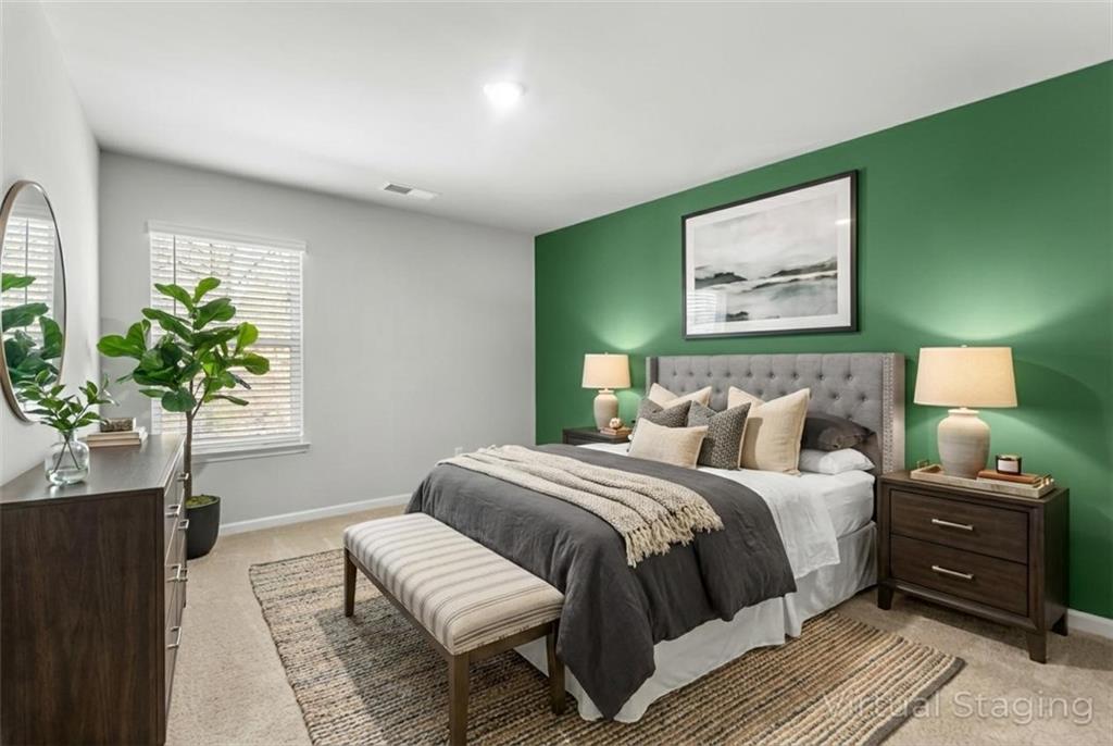 1476 Harlequin Way Stockbridge, GA 30281 - Photo 42 of 57 a bedroom with a bed and a painting on the wall