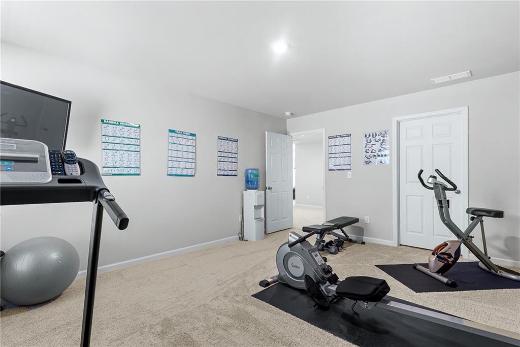 1476 Harlequin Way Stockbridge, GA 30281 - Photo 43 of 62 a view of a room with gym equipment
