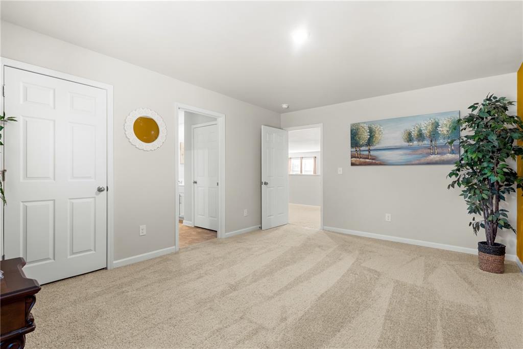 1476 Harlequin Way Stockbridge, GA 30281 - Photo 48 of 57 a view of an entryway with potted plants in front of door