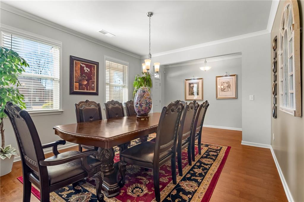 1476 Harlequin Way Stockbridge, GA 30281 - Photo 5 of 57 a dining room with furniture and window