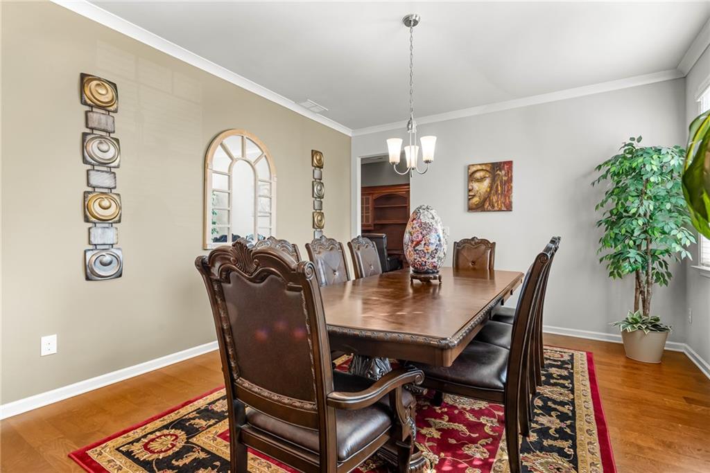 1476 Harlequin Way Stockbridge, GA 30281 - Photo 6 of 57 a view of a dining room with furniture window and wooden floor