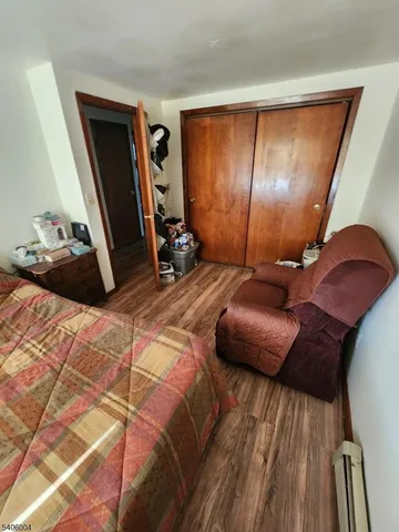 a bedroom with a bed and a mirror