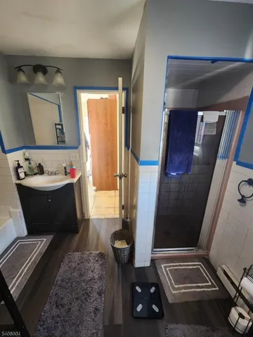 a bathroom with a sink a mirror and vanity