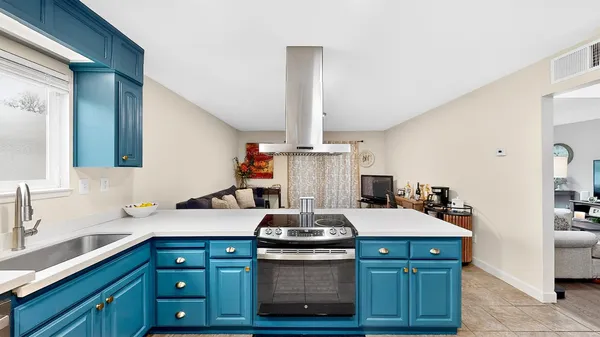 a kitchen with a stove and a sink