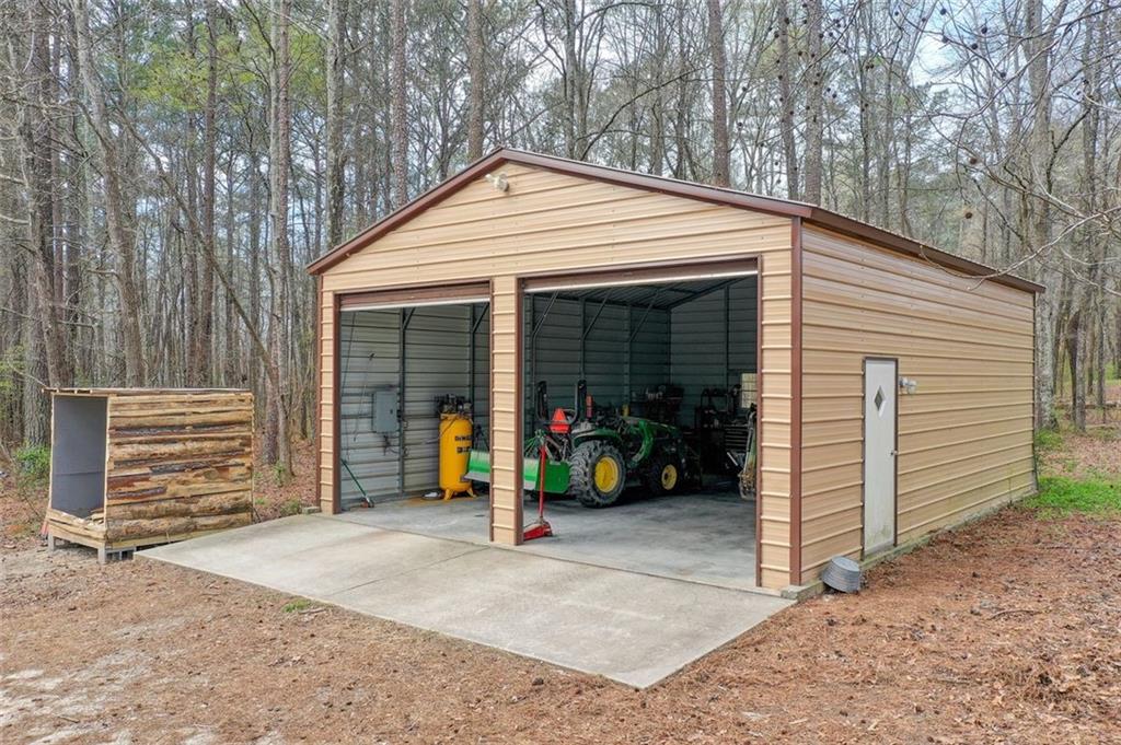 8345 Cleckler Road Palmetto, GA 30268 - Photo 13 of 41 a view of a house with a backyard and porch