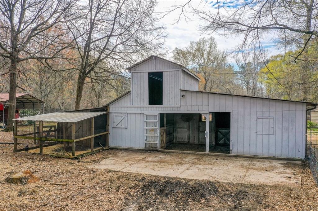 8345 Cleckler Road Palmetto, GA 30268 - Photo 16 of 41 a front view of a house with a yard and garage