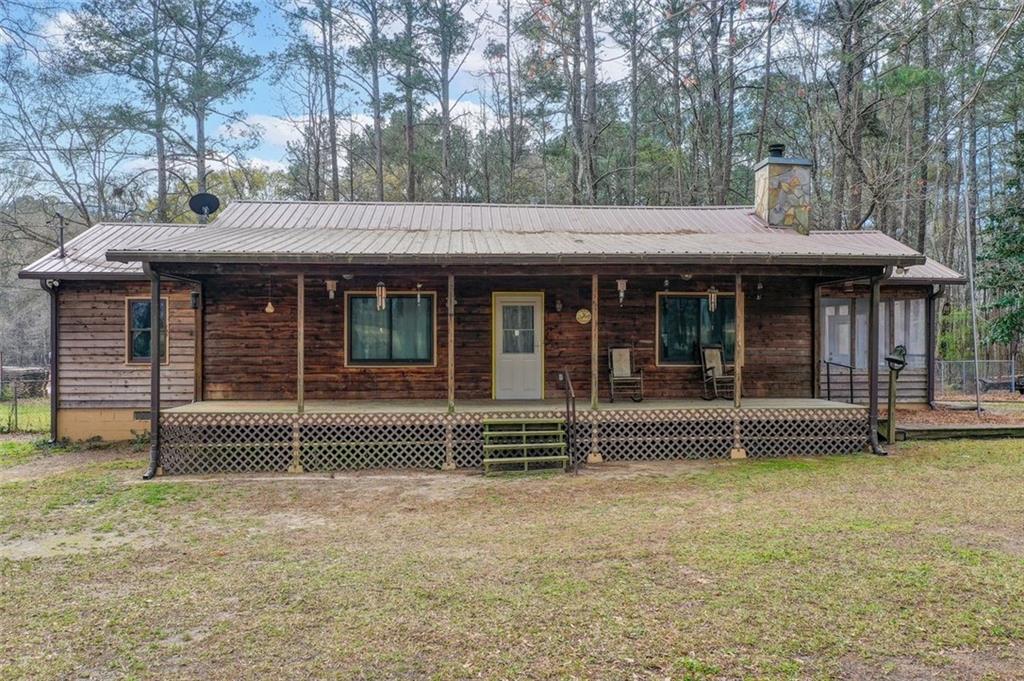 8345 Cleckler Road Palmetto, GA 30268 - Photo 22 of 41 a front view of a house with a garden
