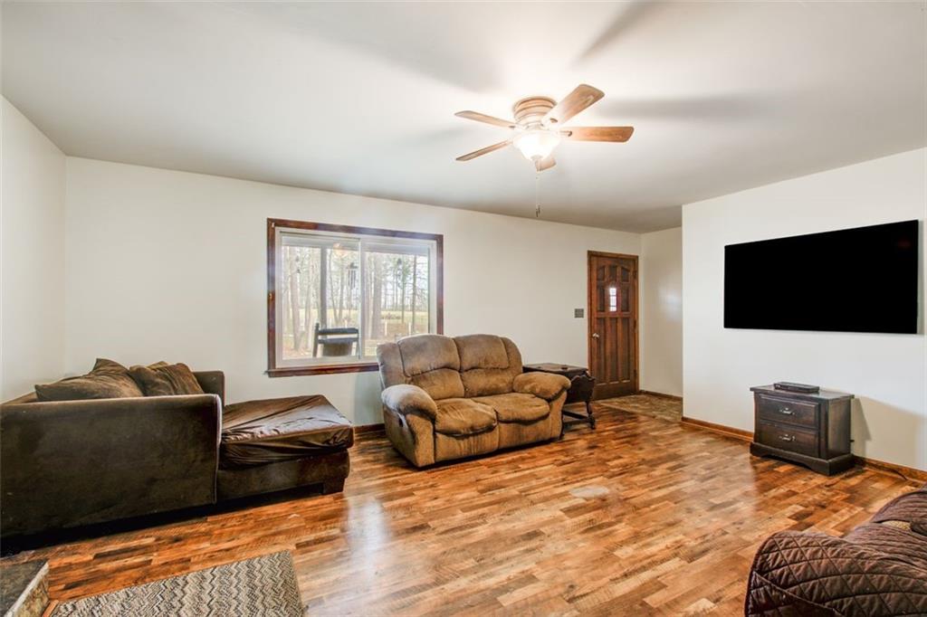 8345 Cleckler Road Palmetto, GA 30268 - Photo 23 of 41 a living room with furniture and a flat screen tv