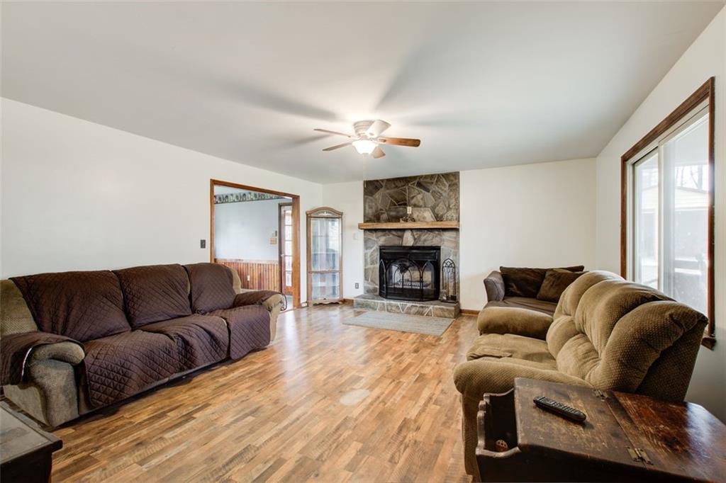 8345 Cleckler Road Palmetto, GA 30268 - Photo 24 of 41 a living room with furniture a fireplace and a flat screen tv