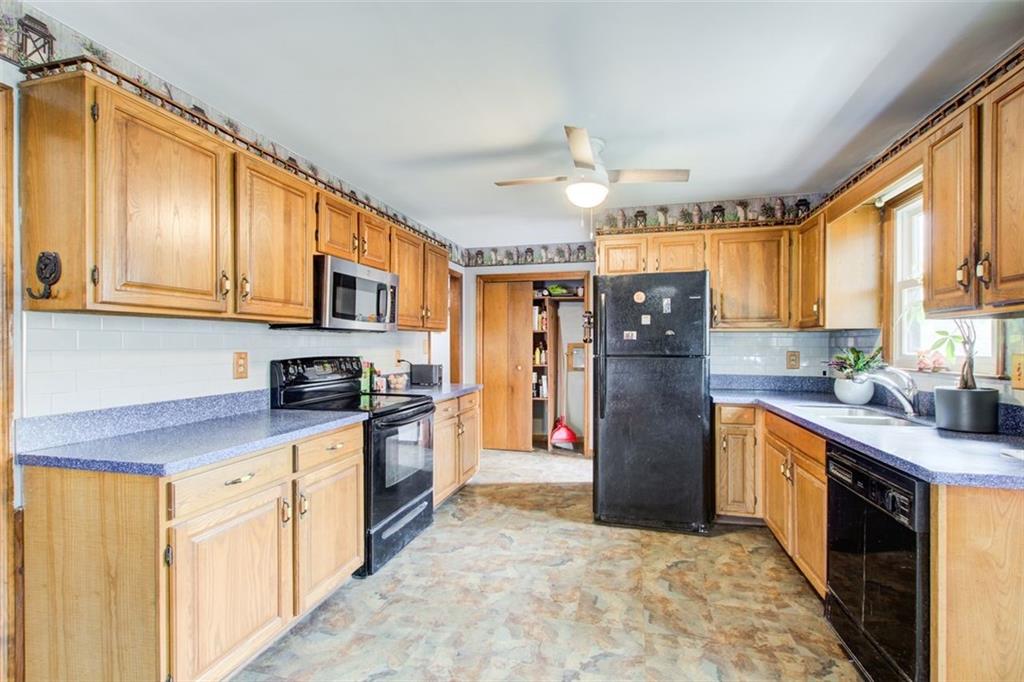 8345 Cleckler Road Palmetto, GA 30268 - Photo 27 of 41 a kitchen with stainless steel appliances granite countertop a refrigerator a stove top oven a sink and dishwasher
