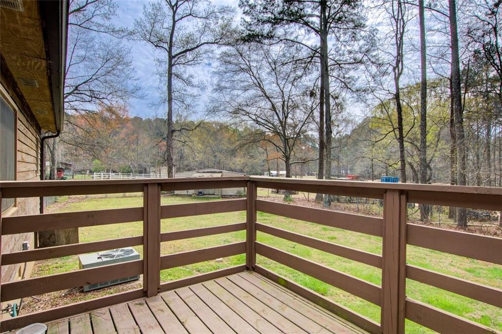 8345 Cleckler Road Palmetto, GA 30268 - Photo 29 of 41 a view of a glass door with a bench