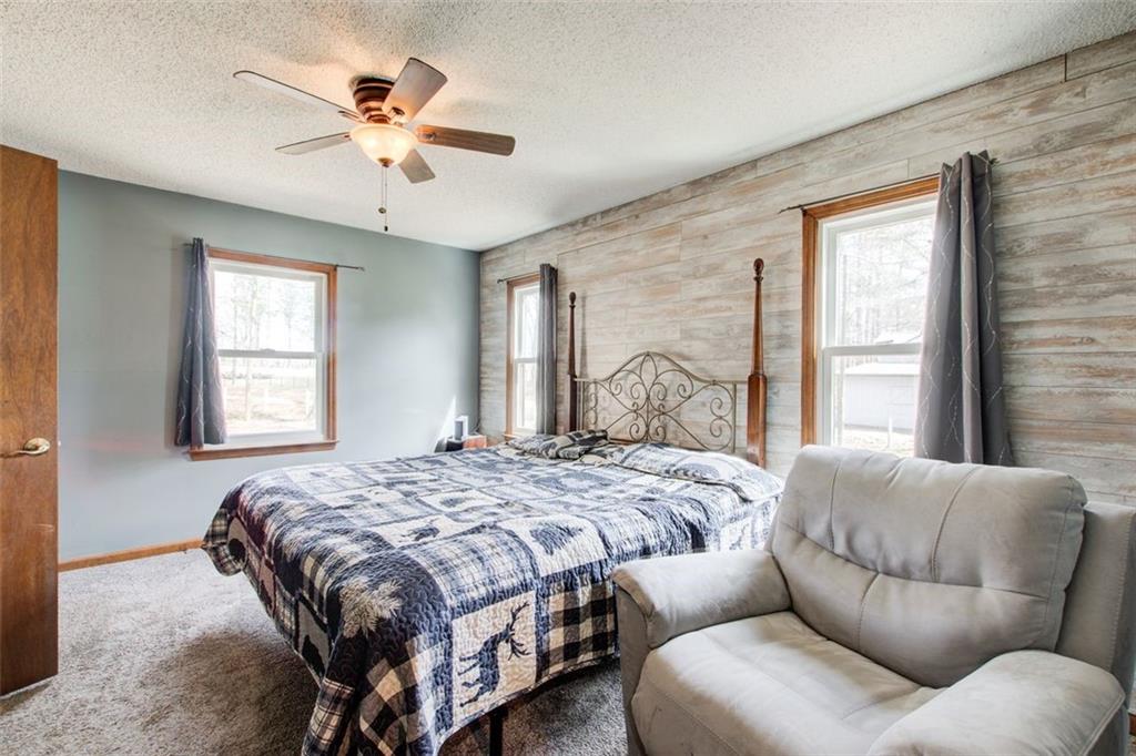 8345 Cleckler Road Palmetto, GA 30268 - Photo 38 of 41 a bedroom with a bed couch and window